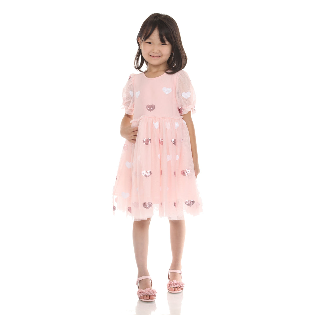Model wearing the Light Pink sequin heart tulle babydoll dress, front view