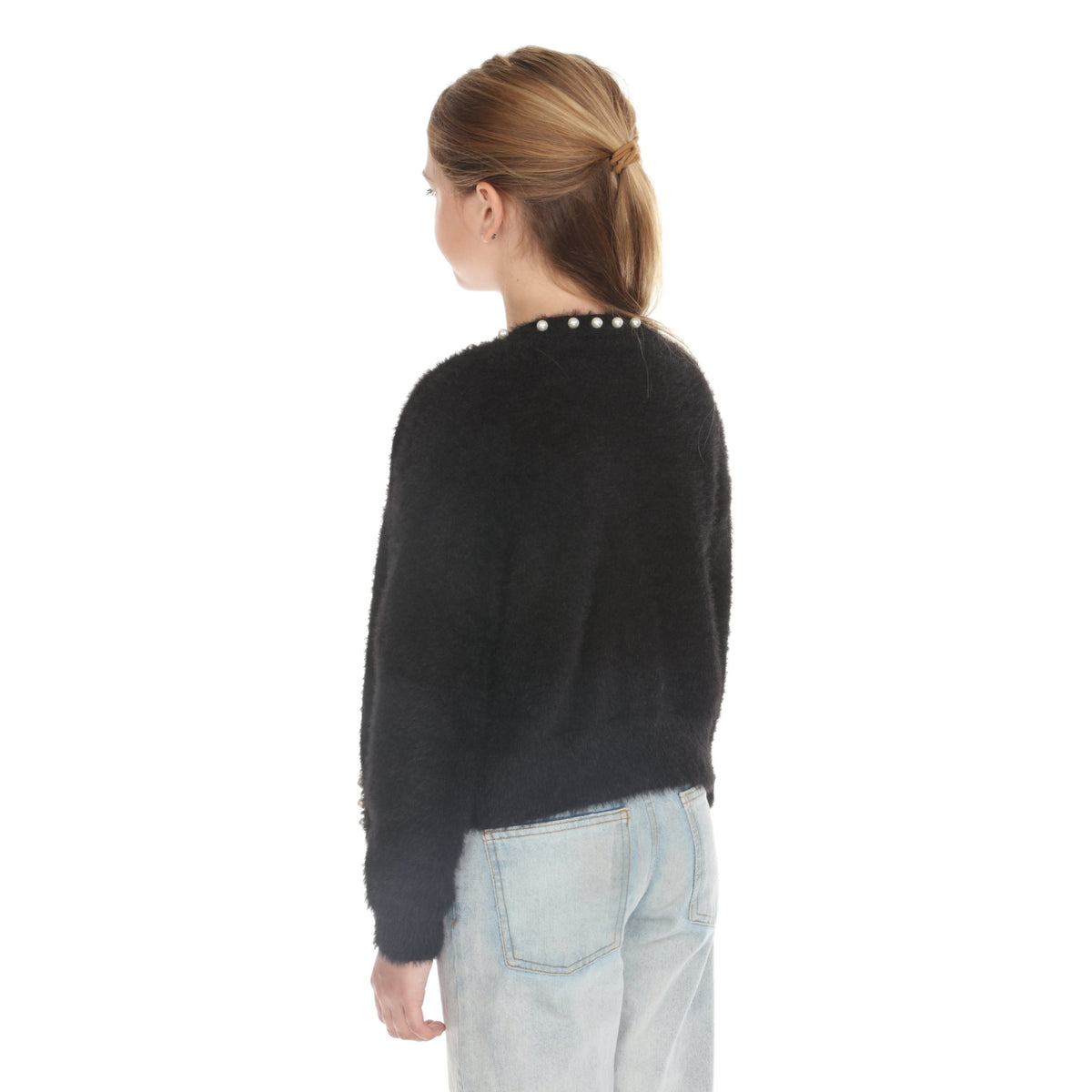 Back view of model in the Black fuzzy cardigan showing pearl trim along the back neckline