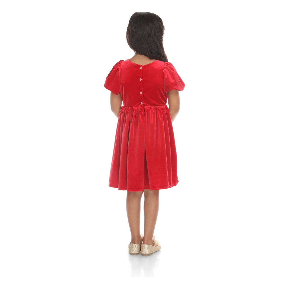 Back view of model in the red velvet bow dress showing buttons down the back and gathered skirt