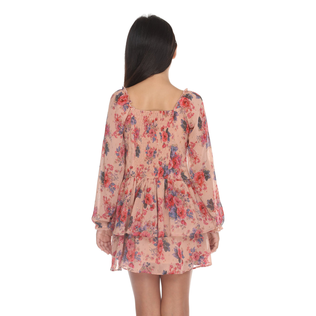 Front view of a long-sleeve floral dress with a smocked bodice, square neckline, and tiered ruffle hem, featuring a pinkish-beige base with red and blue flowers.